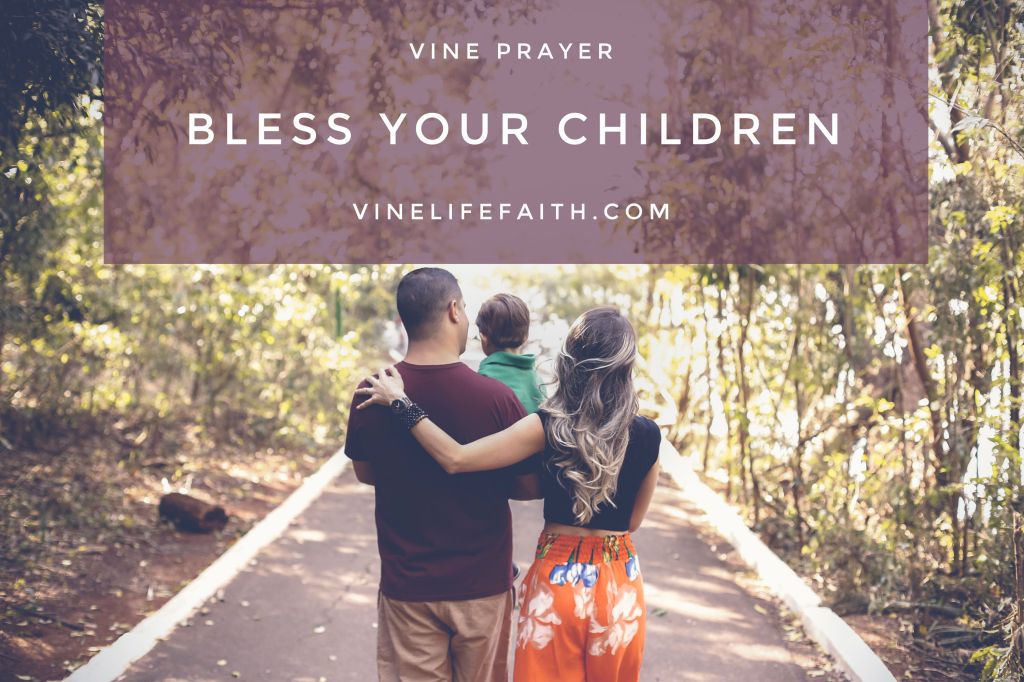 Father, mother and child walking down a path in the woods.